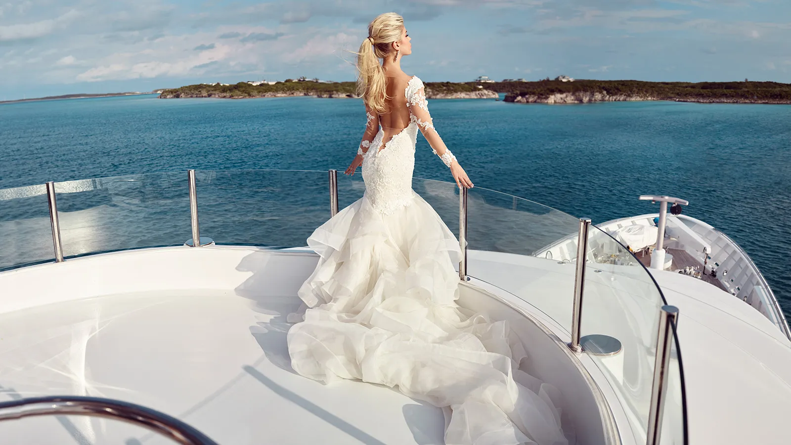 A Bride on her wedding gown standing on the upper deck